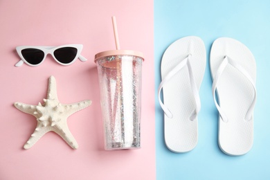 Photo of Flat lay composition with beach objects on color background