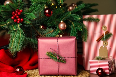 Photo of Composition with beautifully wrapped gift boxes on table