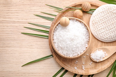 Photo of Flat lay composition with white sea salt on wooden background, space for text. Spa treatment