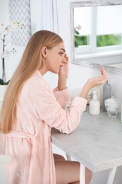 Photo of Young woman with eyelash loss problem indoors