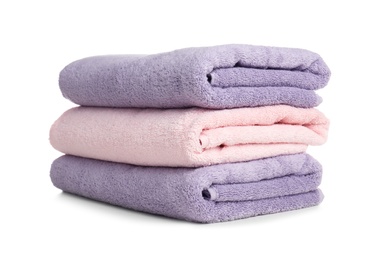 Photo of Folded soft terry towels on white background