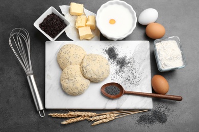 Photo of Flat lay composition with raw dough and ingredients on grey background