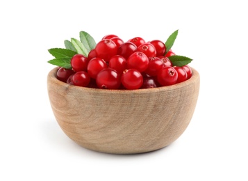 Photo of Fresh ripe cranberries with leaves in bowl isolated on white