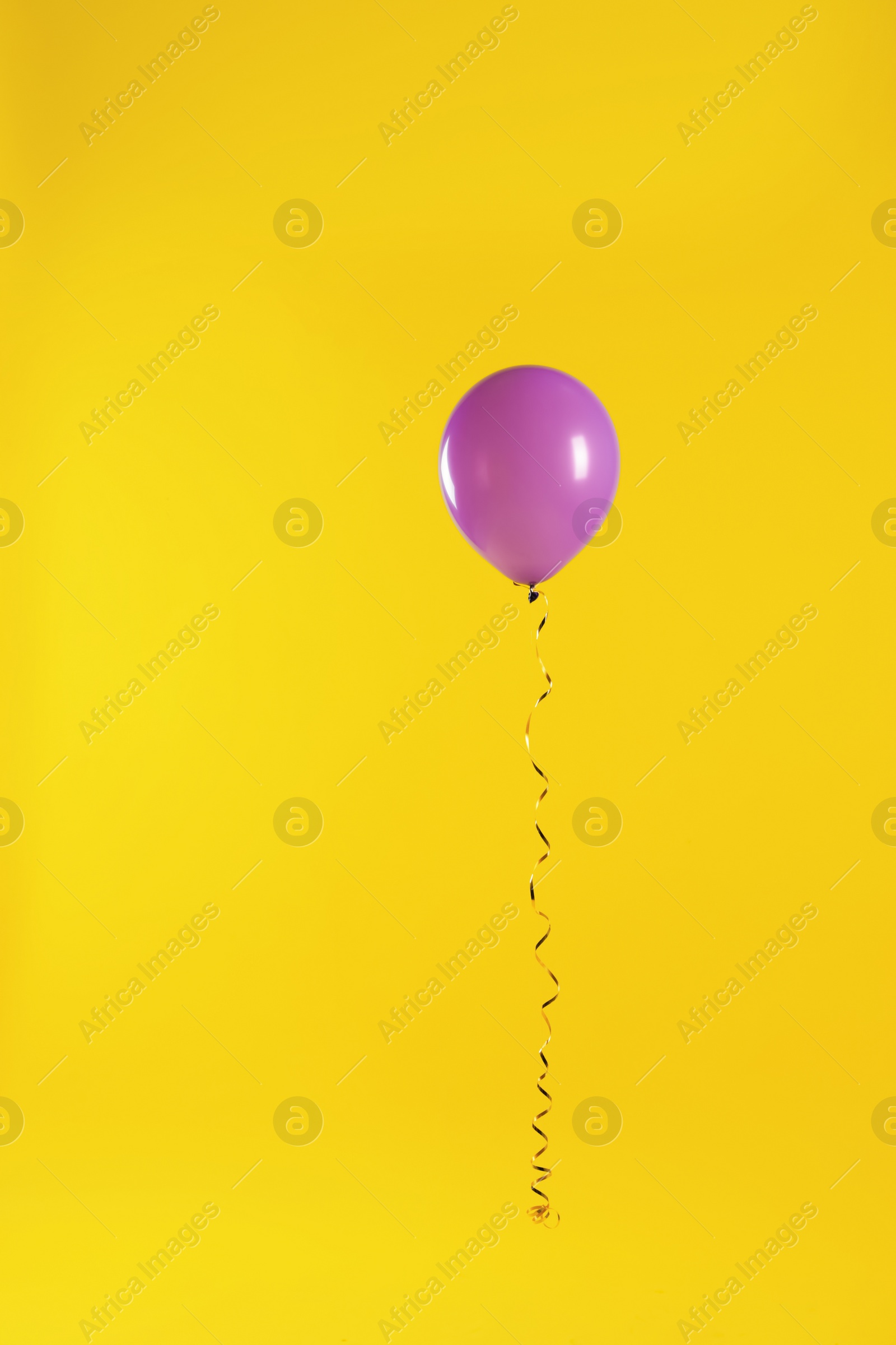 Photo of Bright balloon on color background. Celebration time