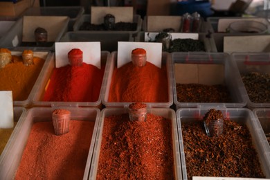 Photo of Assortment of different aromatic spices in containers