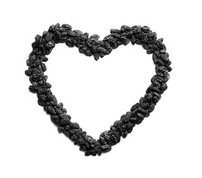 Photo of Heart shaped frame of raisins and space for text on white background. Dried fruit as healthy snack