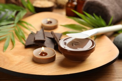 Photo of Cosmetic product for spa body wraps on wooden background