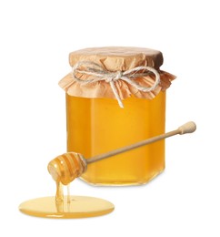 Image of Natural honey dripping from dipper. Jar full of honey on white background