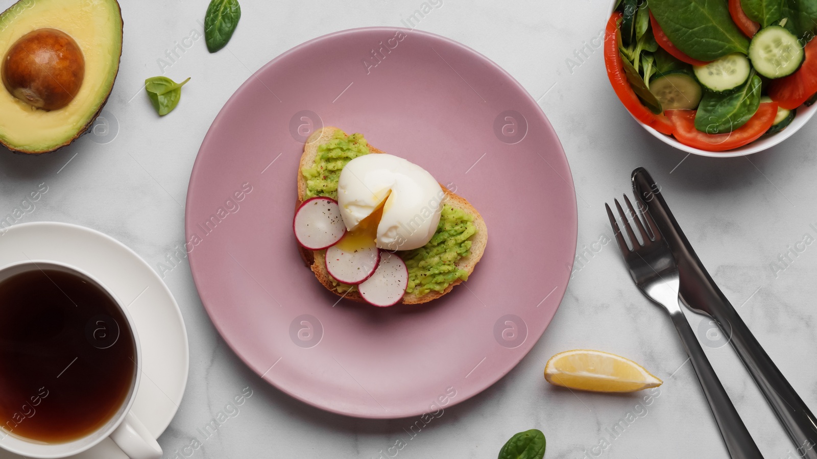 Photo of Delicious sandwich with boiled egg served on white marble table, flat lay