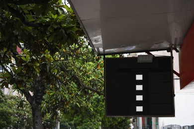 Photo of Board with foreign currency exchange rates outdoors