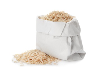 Photo of Bag with brown rice on white background