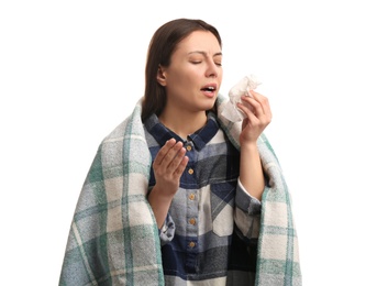 Photo of Young woman with plaid suffering from runny nose on white background