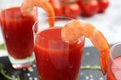 Photo of Delicious shrimp cocktail with tomato sauce, closeup