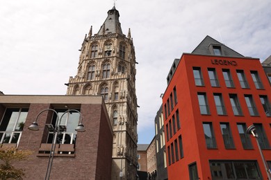 Photo of Cologne, Germany - August 28, 2022: Picturesque view of beautiful buildings on city street