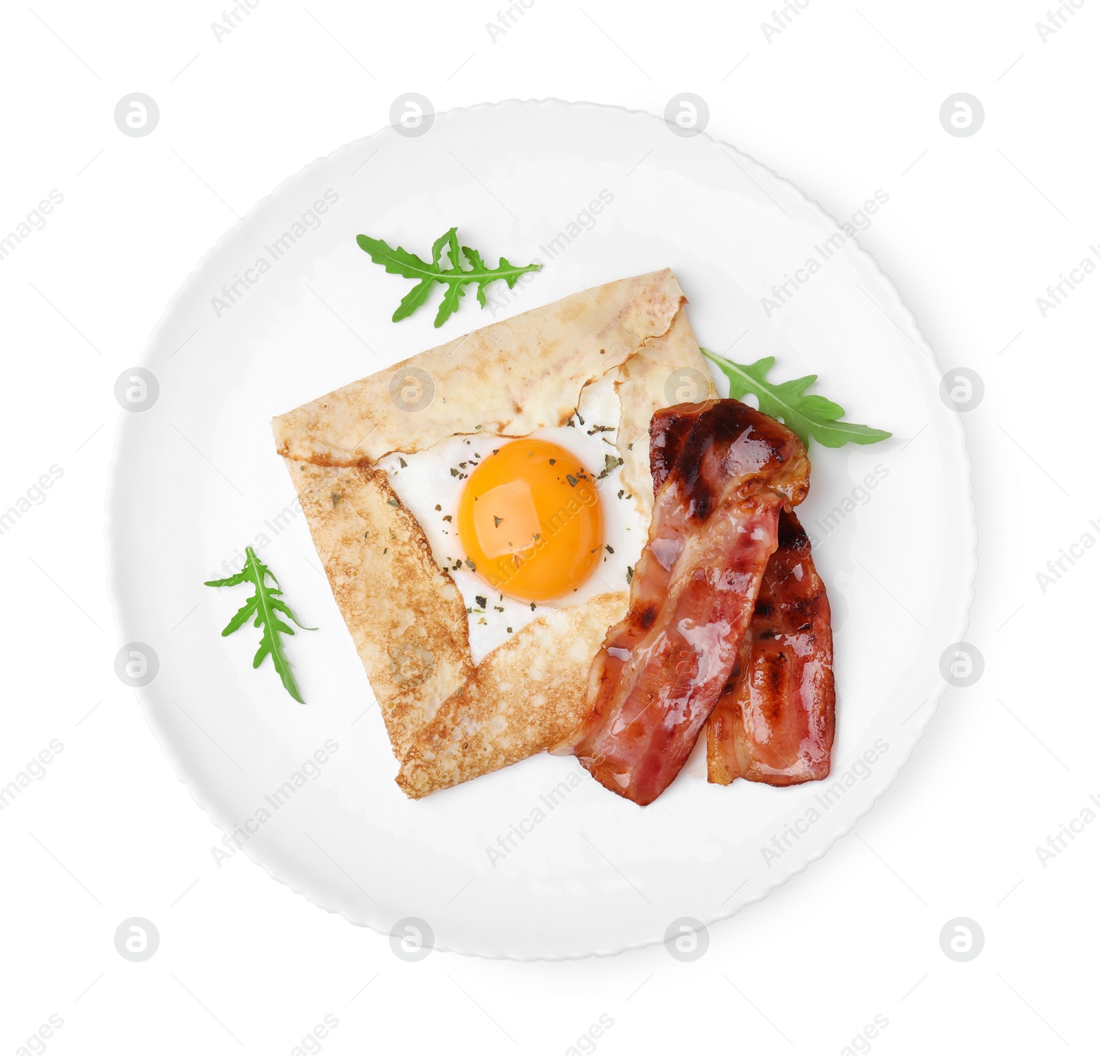 Photo of Delicious crepe with egg isolated on white, top view. Breton galette