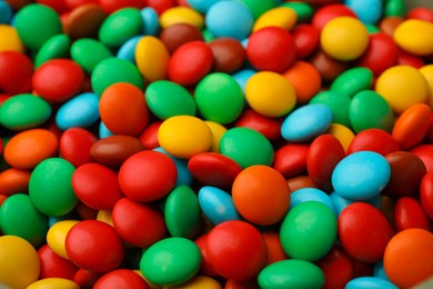 Photo of Tasty colorful candies as background, closeup view