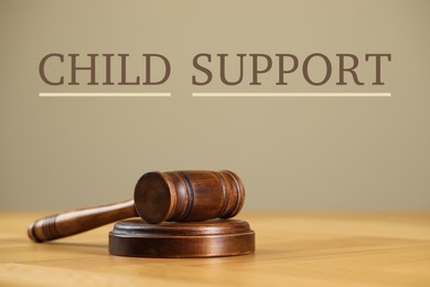 Judge's gavel on wooden table. Child support concept