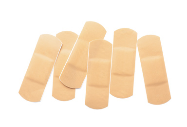 Photo of Medical sticking plasters isolated on white. First aid item