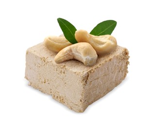 Image of Tasty halva, cashew nuts and green leaves isolated on white