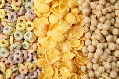 Photo of Different types of breakfast cereals as background, top view