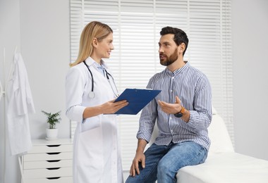 Photo of Patient having appointment with doctor in clinic