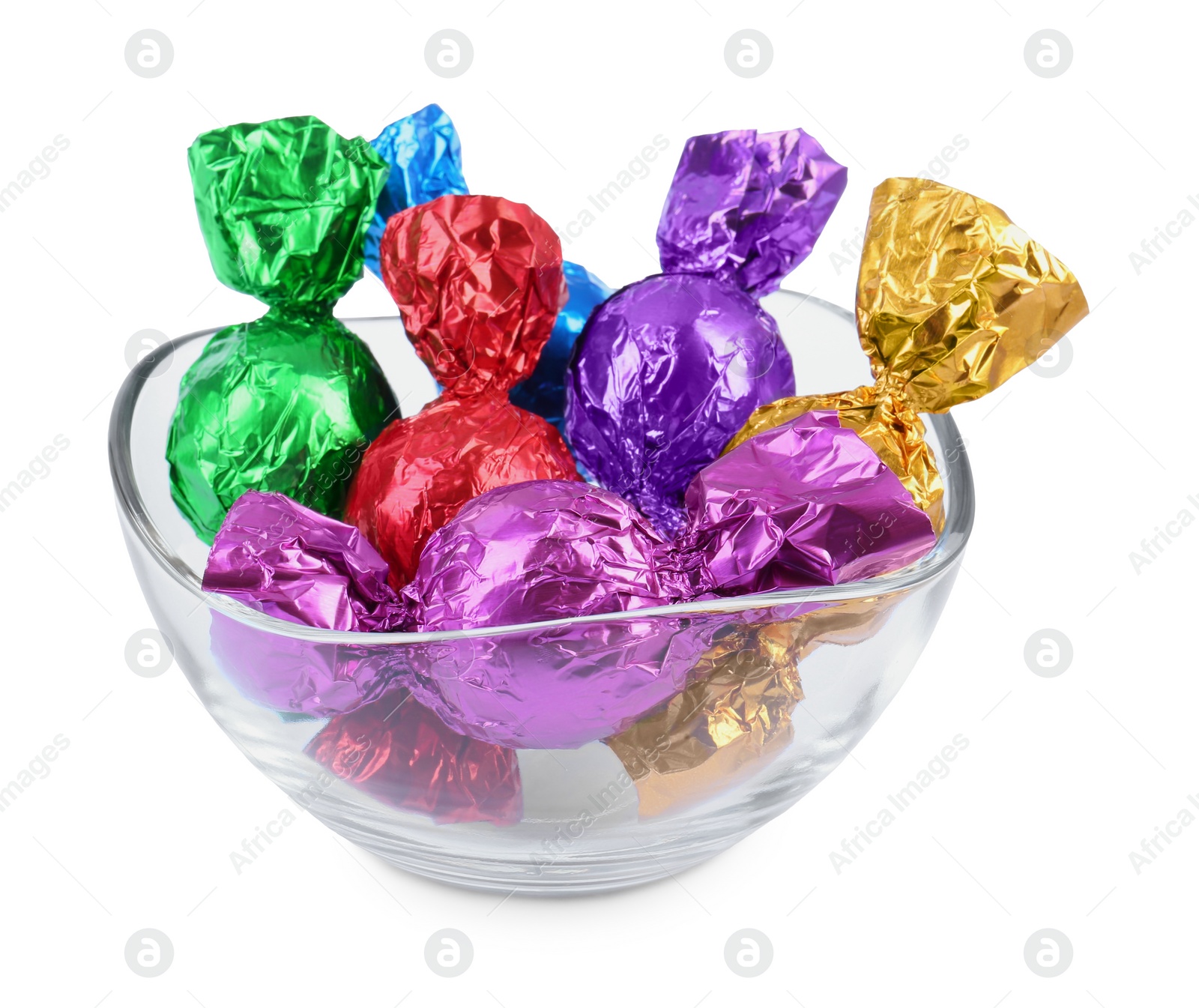 Photo of Bowl with many tasty candies in colorful wrappers isolated on white