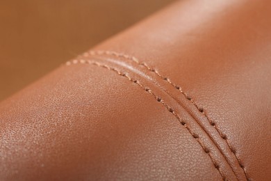 Texture of brown leather as background, closeup