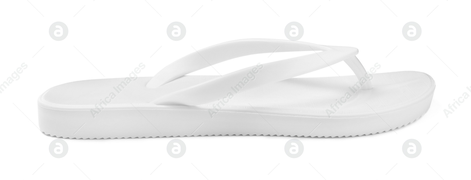 Photo of Single flip flop isolated on white. Beach footwear