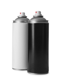 Cans of different spray paints on white background