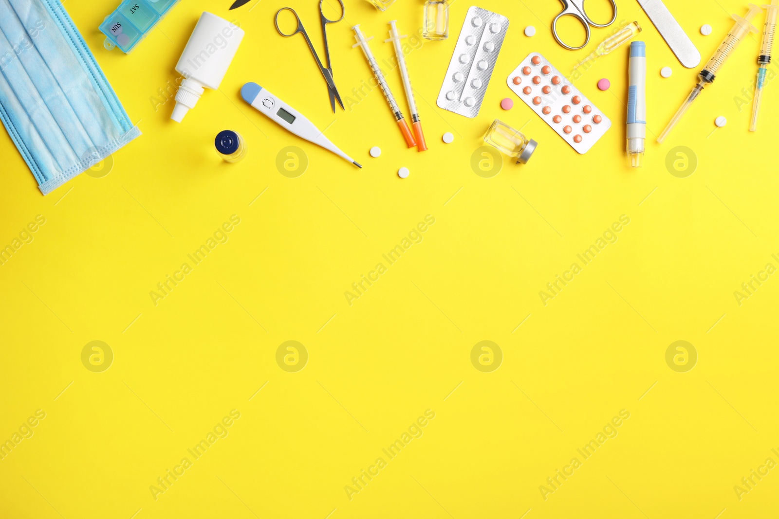 Photo of Flat lay composition with medical items and space for text on color background