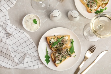 Delicious bruschettas with fish on marble table, flat lay