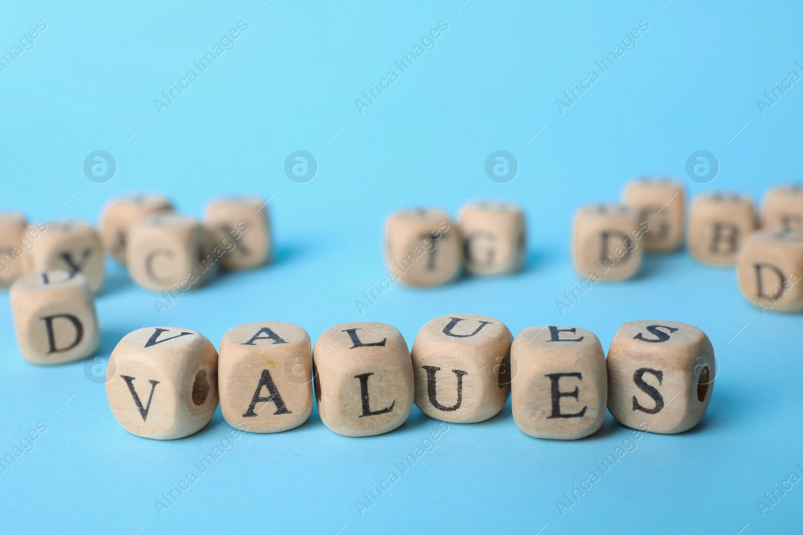 Photo of Beads with word VALUES on light blue background