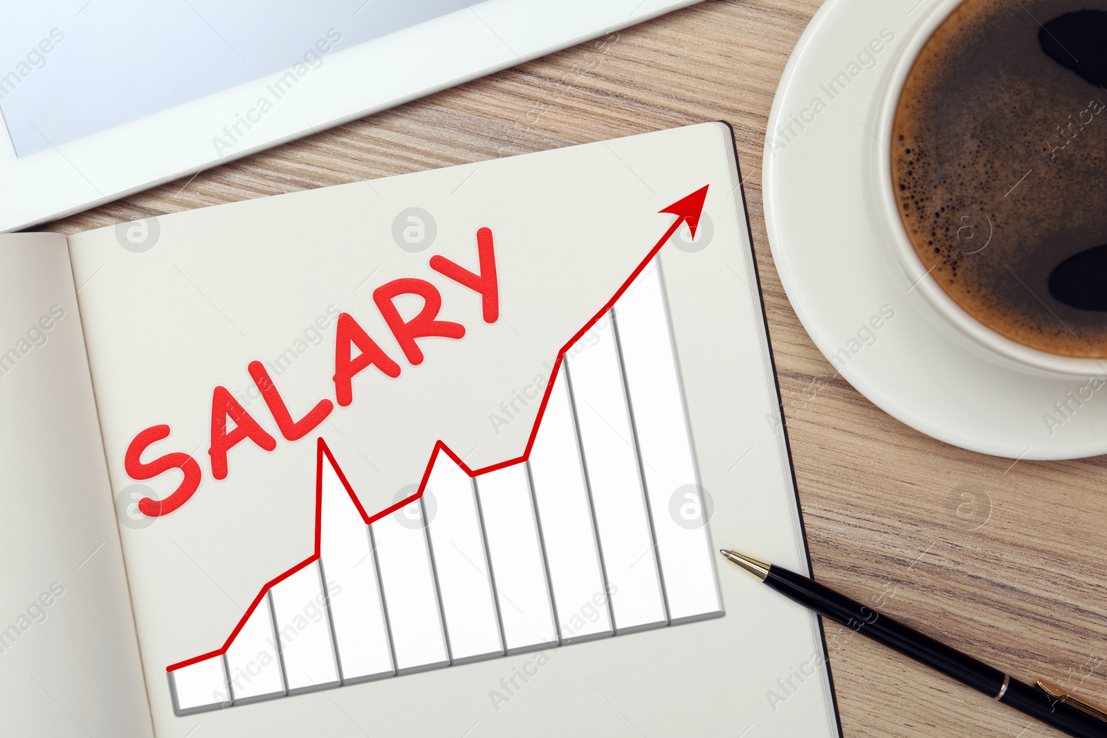 Image of Salary increase concept. Up arrow and growing charts drawn in notebook on wooden table, flat lay