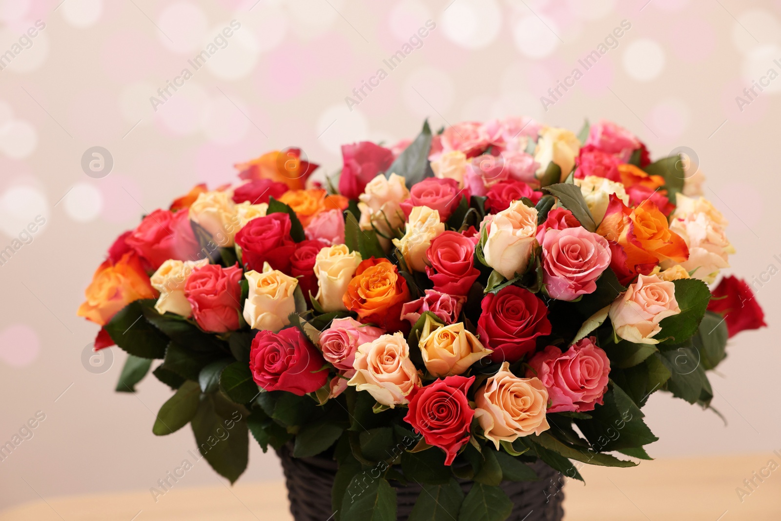 Photo of Bouquet of beautiful roses on light background