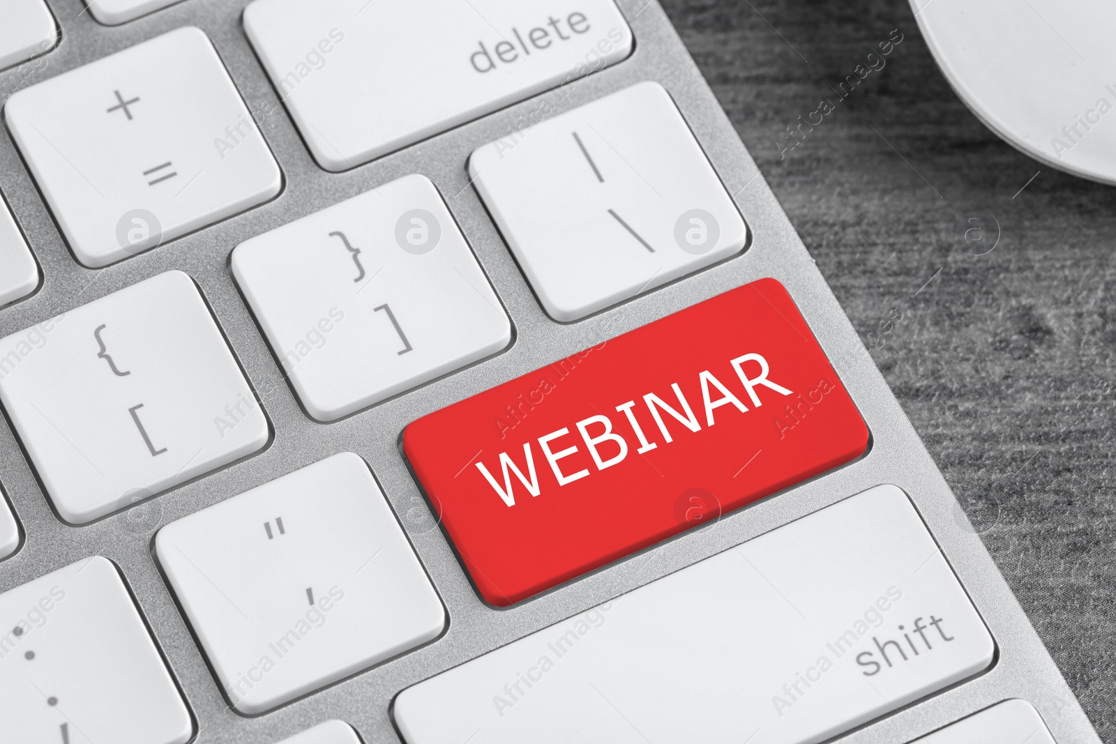 Image of Online learning. Red button with word Webinar on computer keyboard, closeup