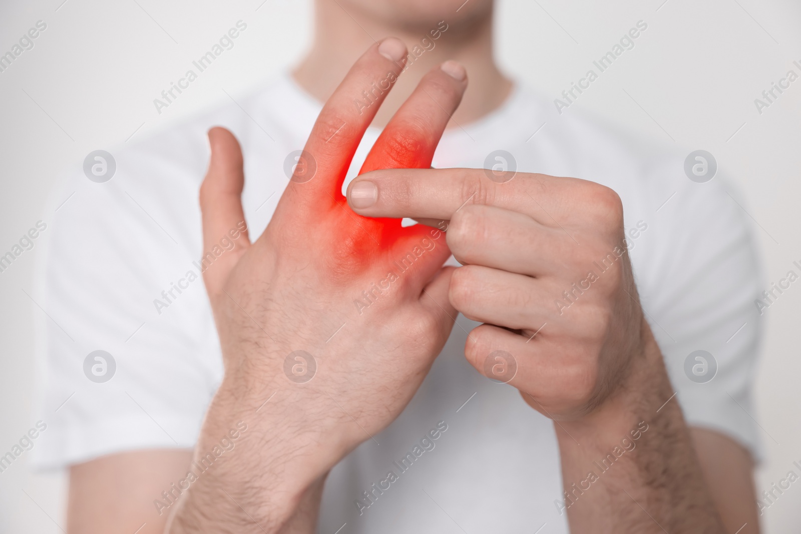 Image of Man suffering from rheumatism on light background, closeup