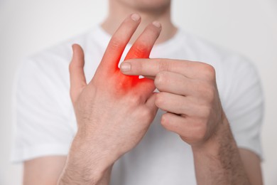 Image of Man suffering from rheumatism on light background, closeup