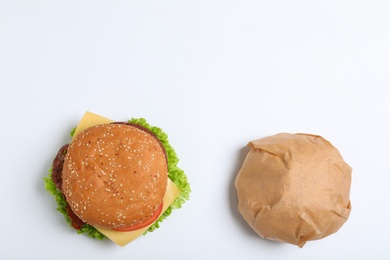 Photo of Fresh burgers on white background, top view