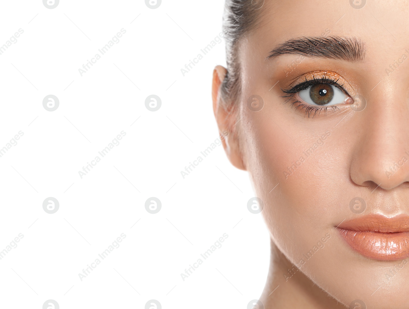 Photo of Beautiful young woman with glitter makeup on white background, closeup view