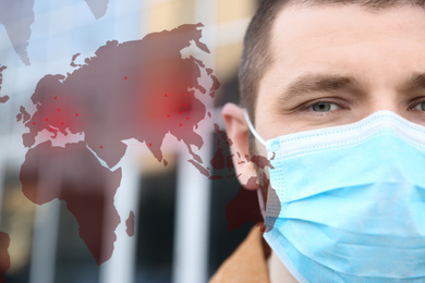 Man wearing medical mask outdoors, closeup. Dangerous virus