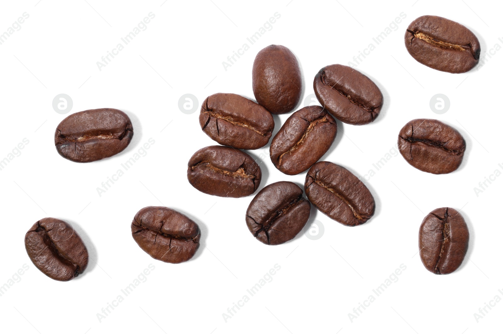 Photo of Many roasted coffee beans isolated on white, top view