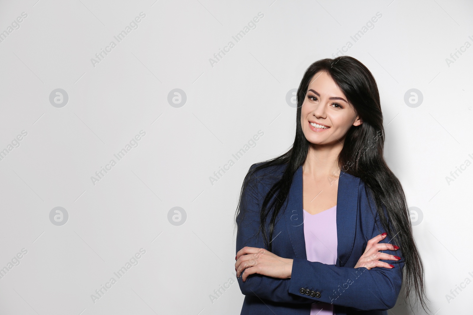 Photo of Portrait of stylish businesswoman on light background, space for text