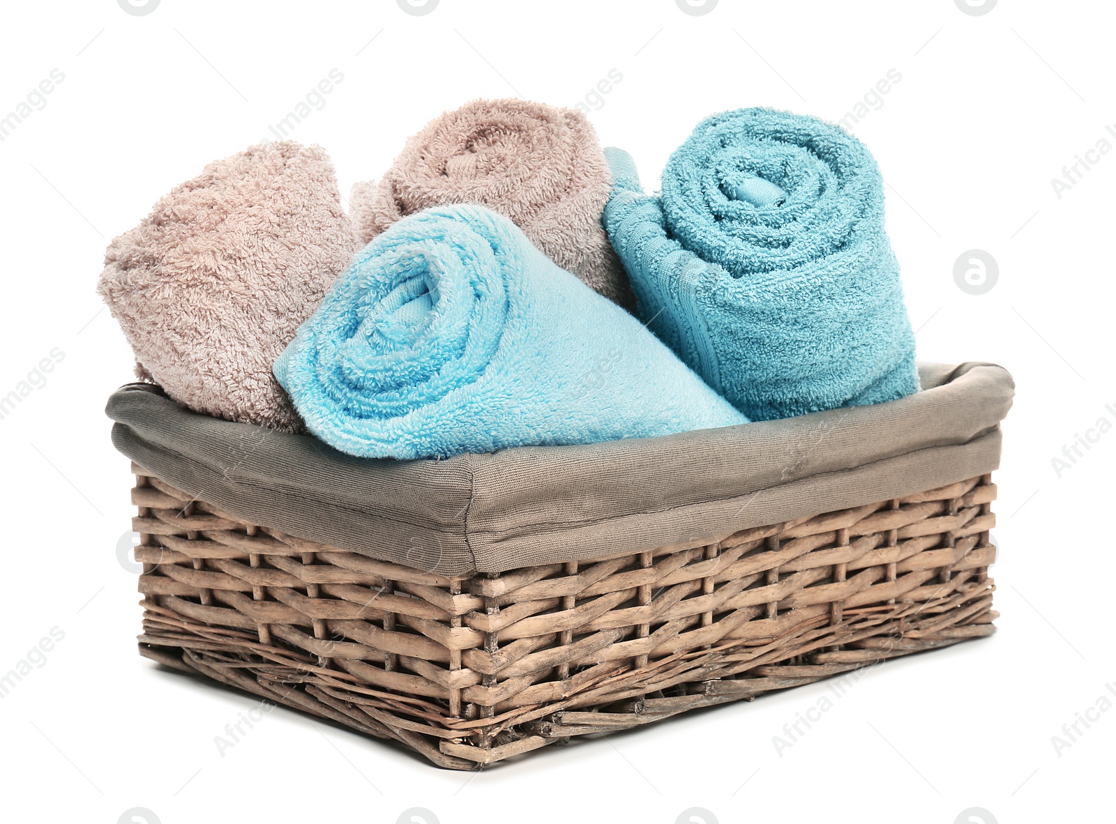 Photo of Basket with clean soft towels on white background