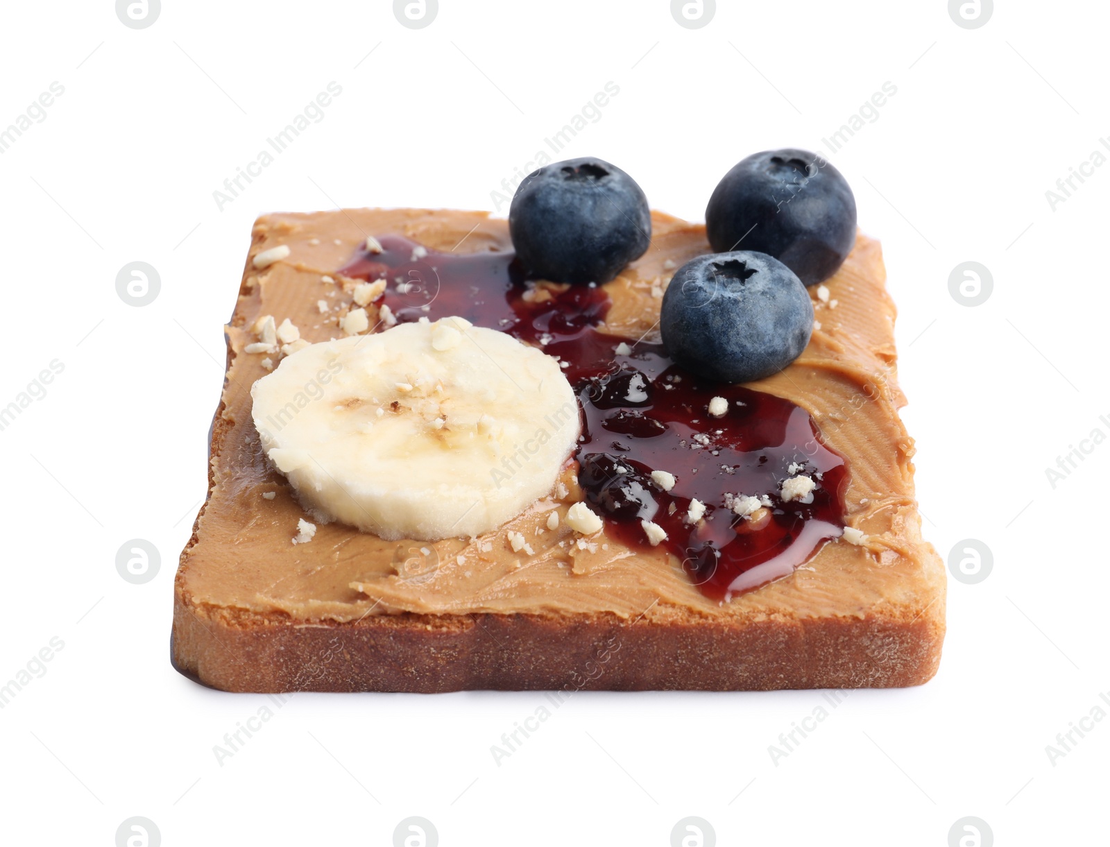 Photo of Toast with tasty nut butter, jam, blueberries, nuts and banana isolated on white