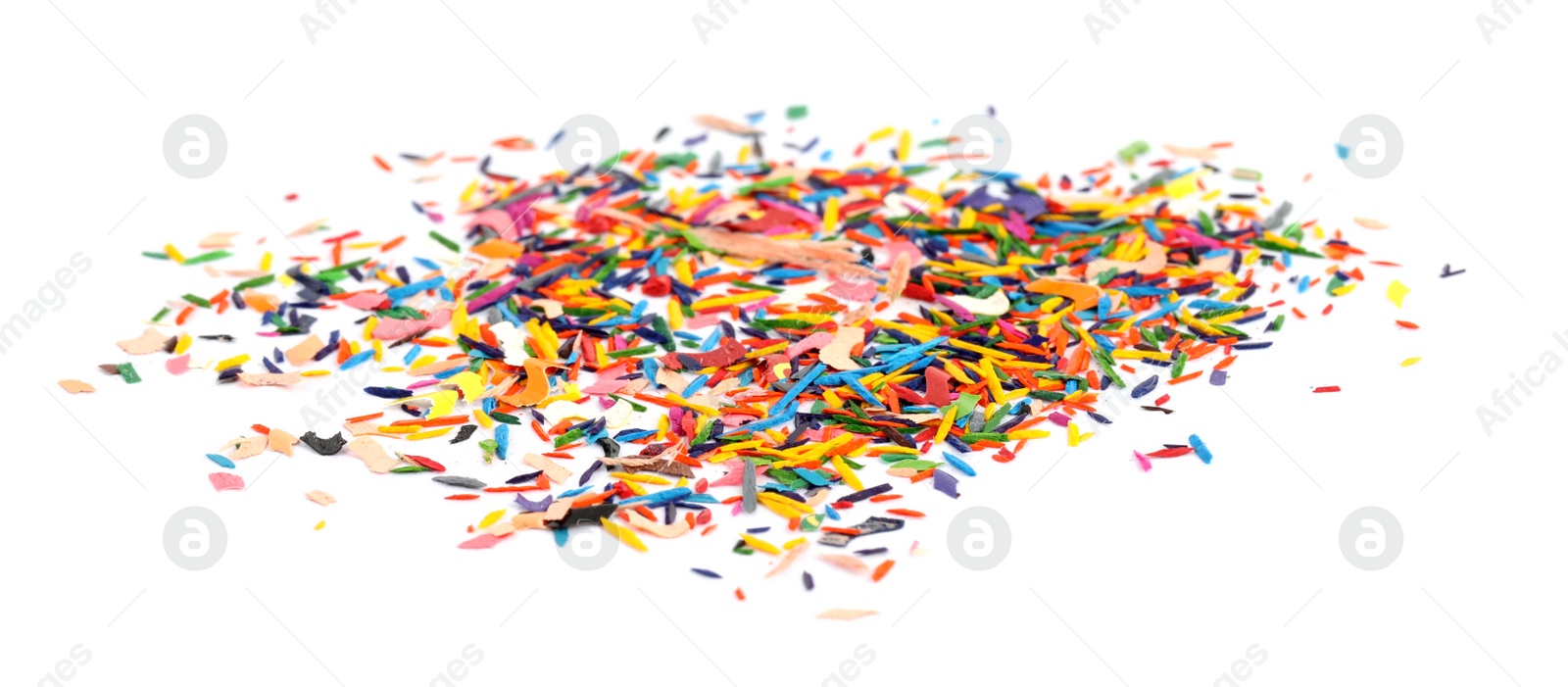 Photo of Colorful graphite crumbs on white background. Pencil sharpening