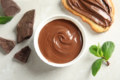 Photo of Flat lay composition with tasty chocolate mousse, bread and mint on table