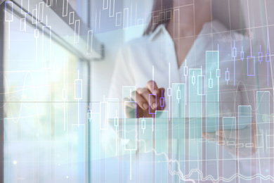 Image of Forex trading. Double exposure of charts and woman using tablet computer, closeup