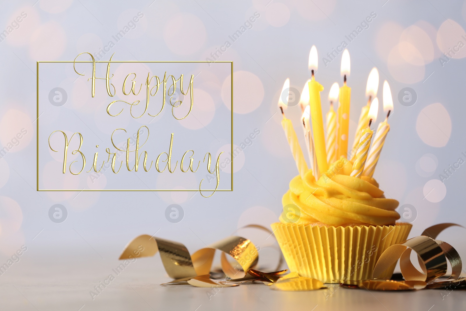 Image of Delicious cupcake with burning candles and text Happy birthday on blurred background