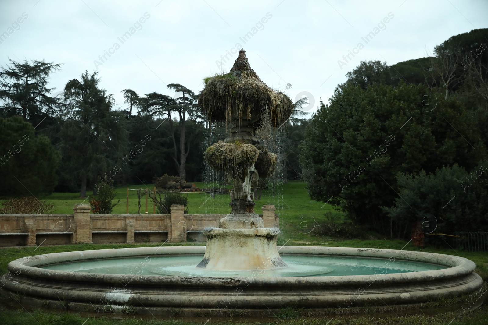 Photo of Beautiful view of fountain in park on cloudy day