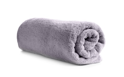 Photo of Rolled soft terry towel on white background